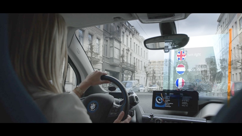 A Woman driving a BMW uses Alphabet