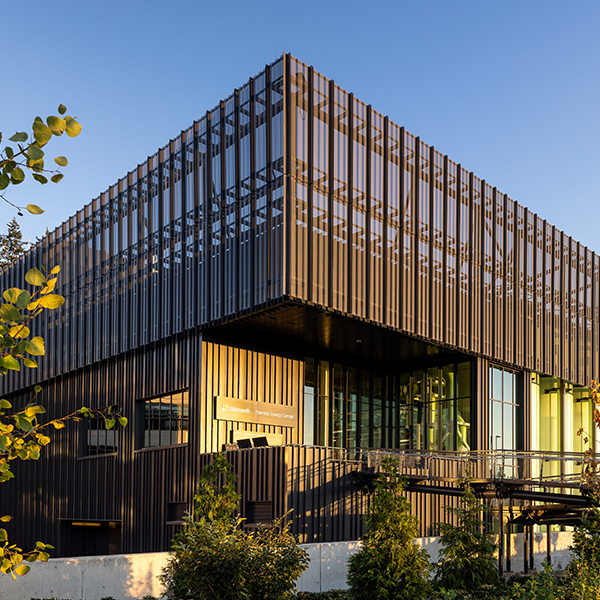 Exterior view of the Microsoft Thermal Energy Center, featuring its modern industrial design with sleek metal cladding.