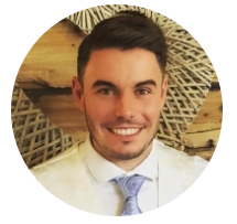 Chester, a smiling man wearing a suit and tie