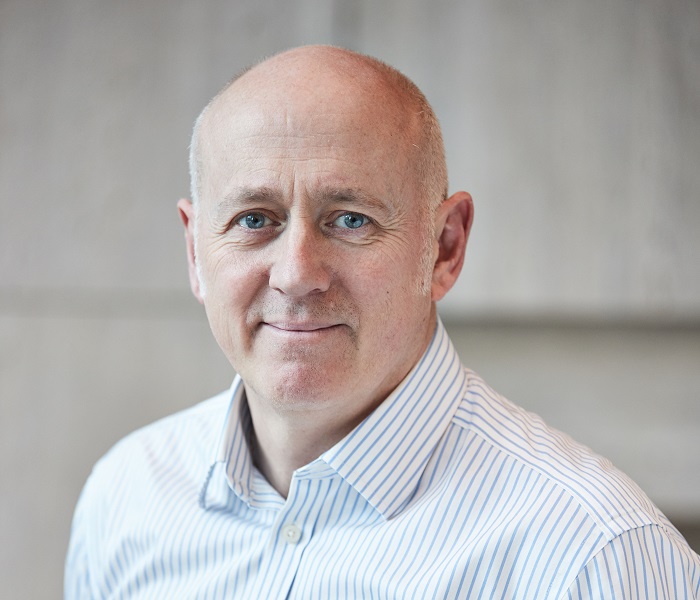 Chris Ensor, a man smiling for the camera