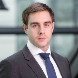 Stephen Morris, a man wearing a suit and tie