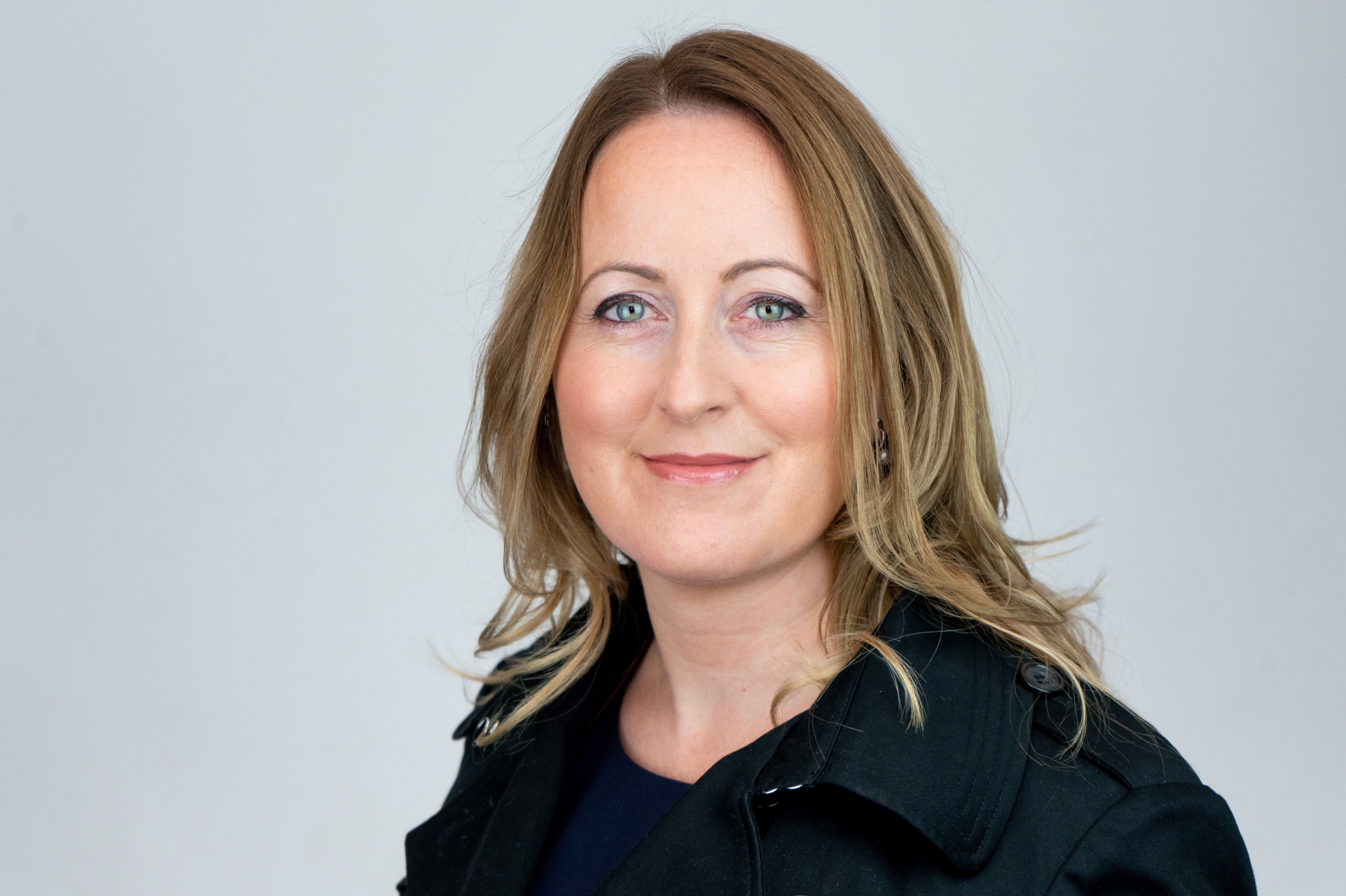 Heather Schossig, a woman smiling for the camera