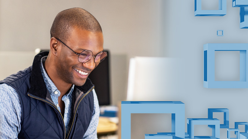 A man in glasses smiles