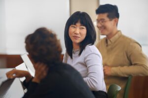 a man and a woman looking at the camera