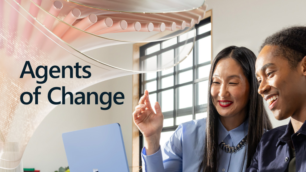 A woman sitting at a desk with a laptop