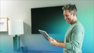 A man holding a tablet.