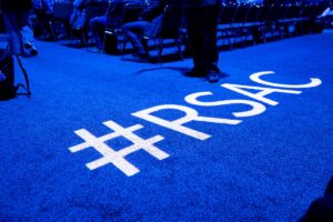 The floor at the RSA conference with the hashtag #RSAC projected onto the carpet.