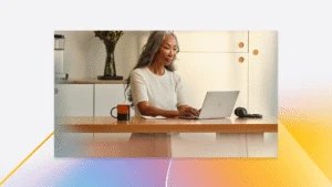 A woman sitting at a desk using a laptop