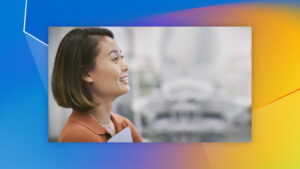 A woman looking off to the side with a smile