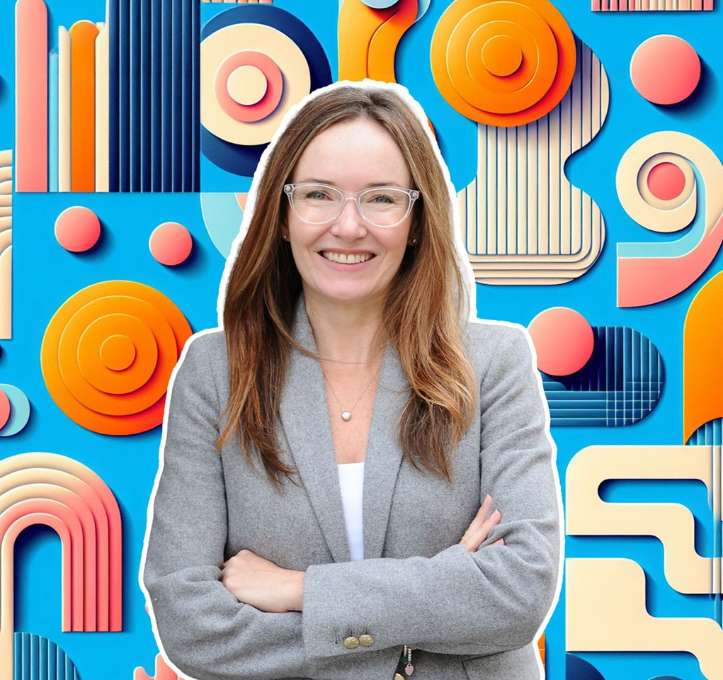 A woman in front of a background of colors and shapes.
