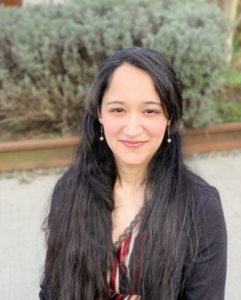 A woman smiling at the camera