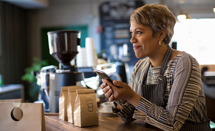 Image of a small business owner using a mobile device