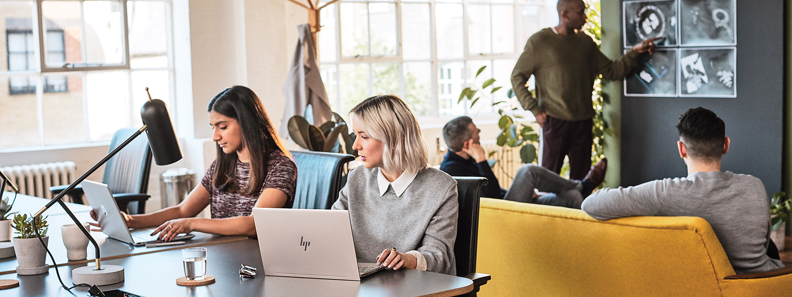 Image of a group of Firstline Workers working together in an open space work environment