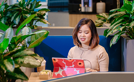 Image of a woman working on mobile device