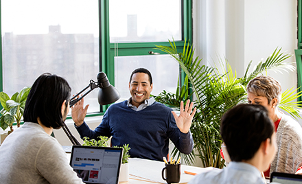 Image of a small business team collaborating in modern workplace