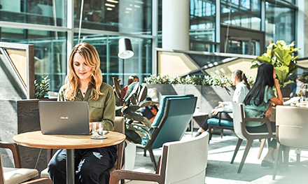 A woman working remotely on her laptop PC
