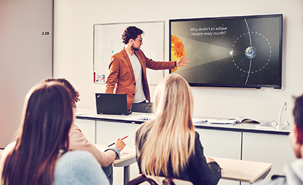 Image of a presenter giving a presentation in PowerPoint