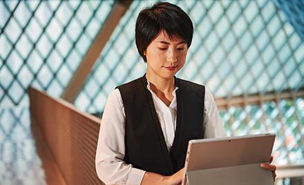 Image of a woman working on her laptop