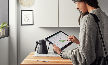 Image of a worker at home using a tablet