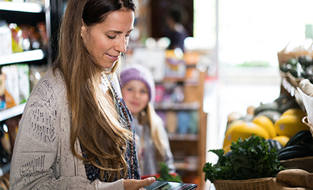Image of a woman scrolling on her phone