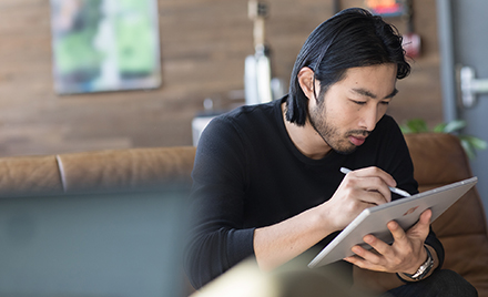 Image of a worker working on a tablet