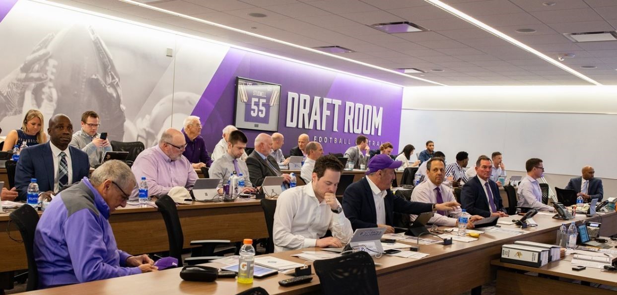 An image showing people in the Draft Room working on computers