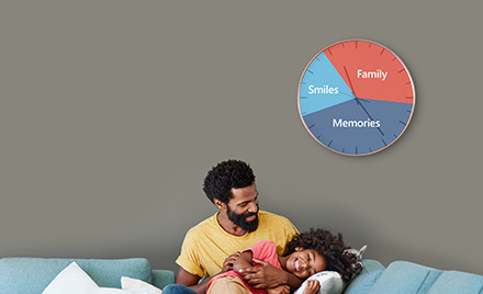 Image of a father and daughter on a couch