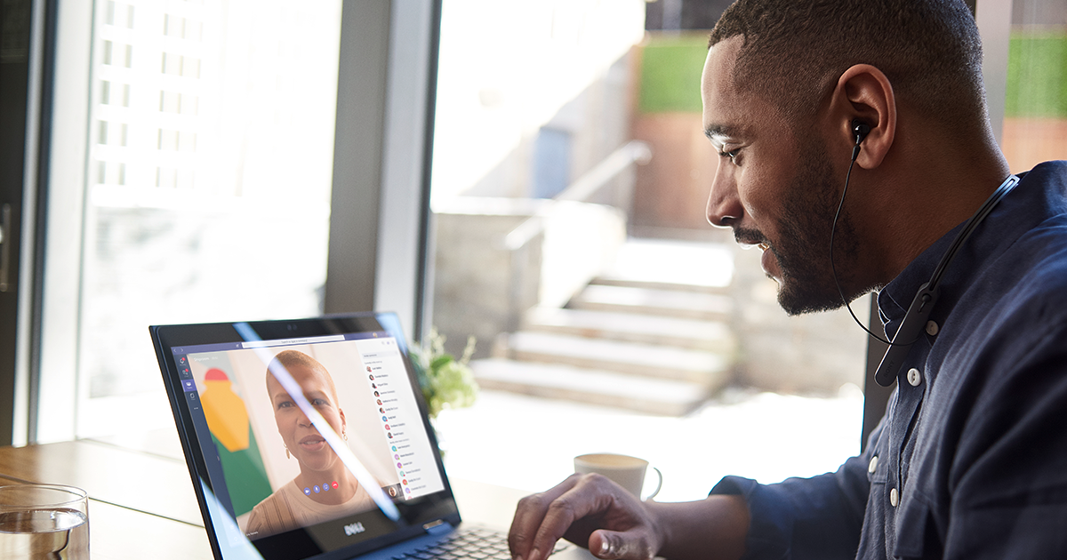 A remote worker in a Teams meeting on his laptop