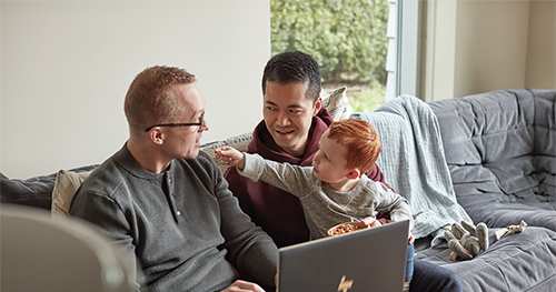 LGBTQ family with fathers and son using HP Spectre X360 15