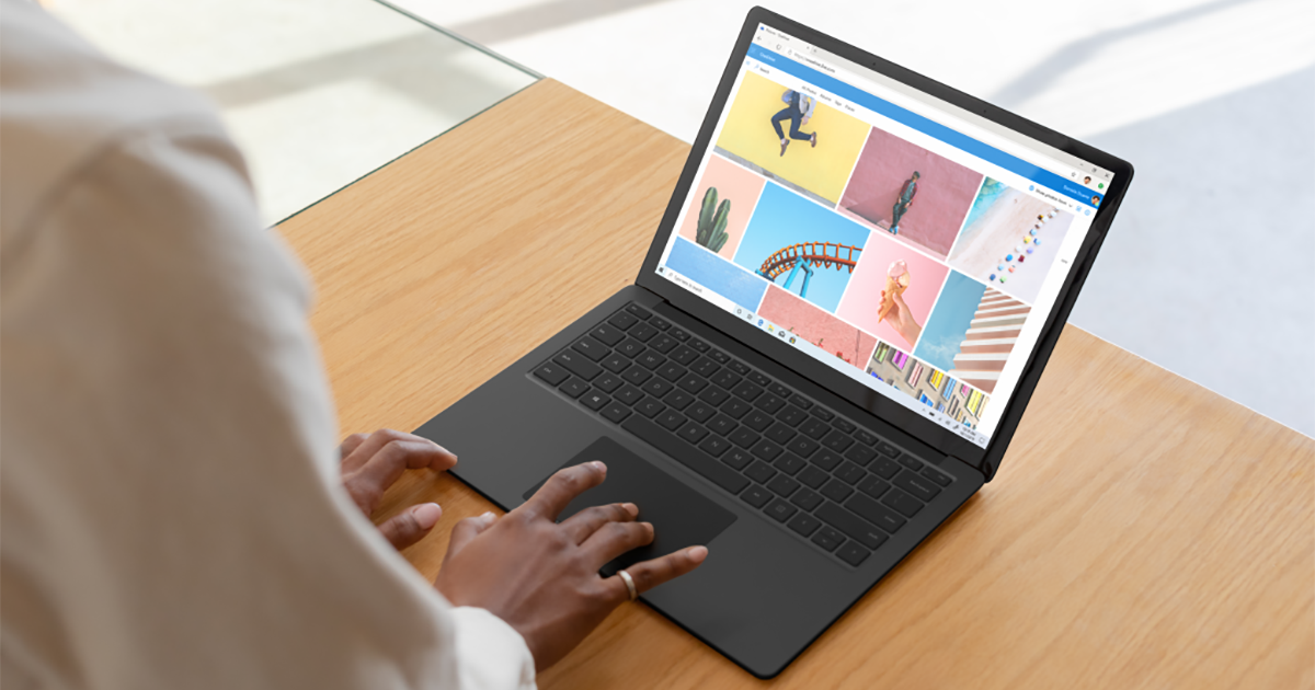 An image of woman browsing in Edge on Black Surface Laptop 3