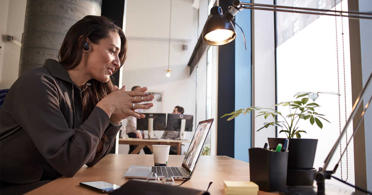 An image of a female tech executive working on her laptop computer