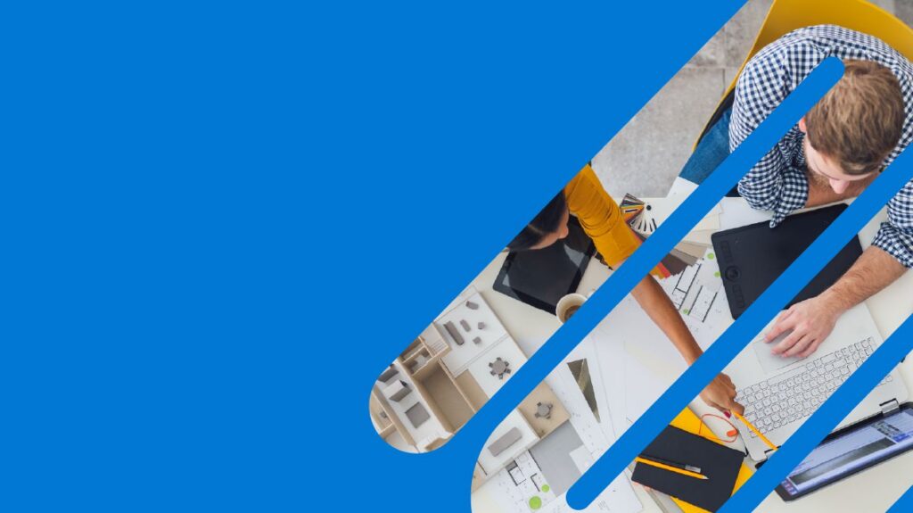 Birds eye view of two people working at a desk