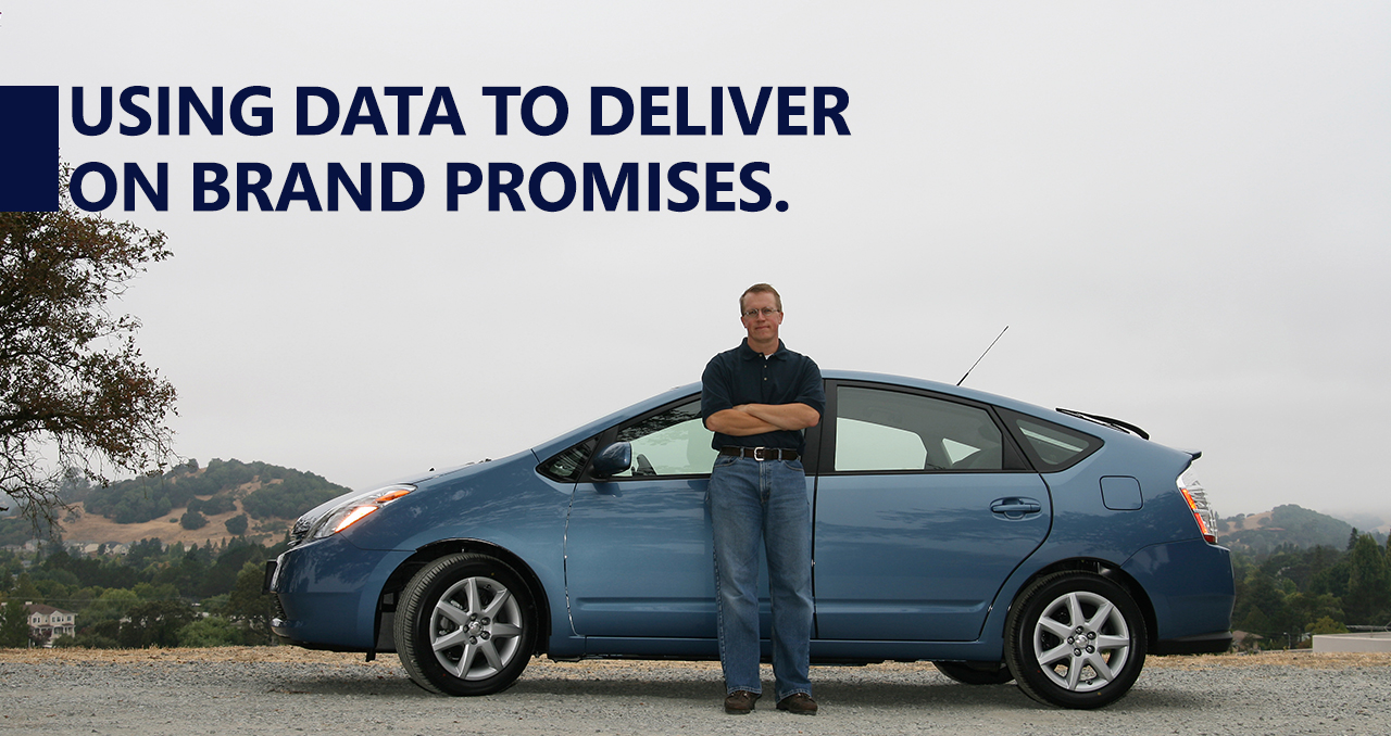 a man standing in front of a car
