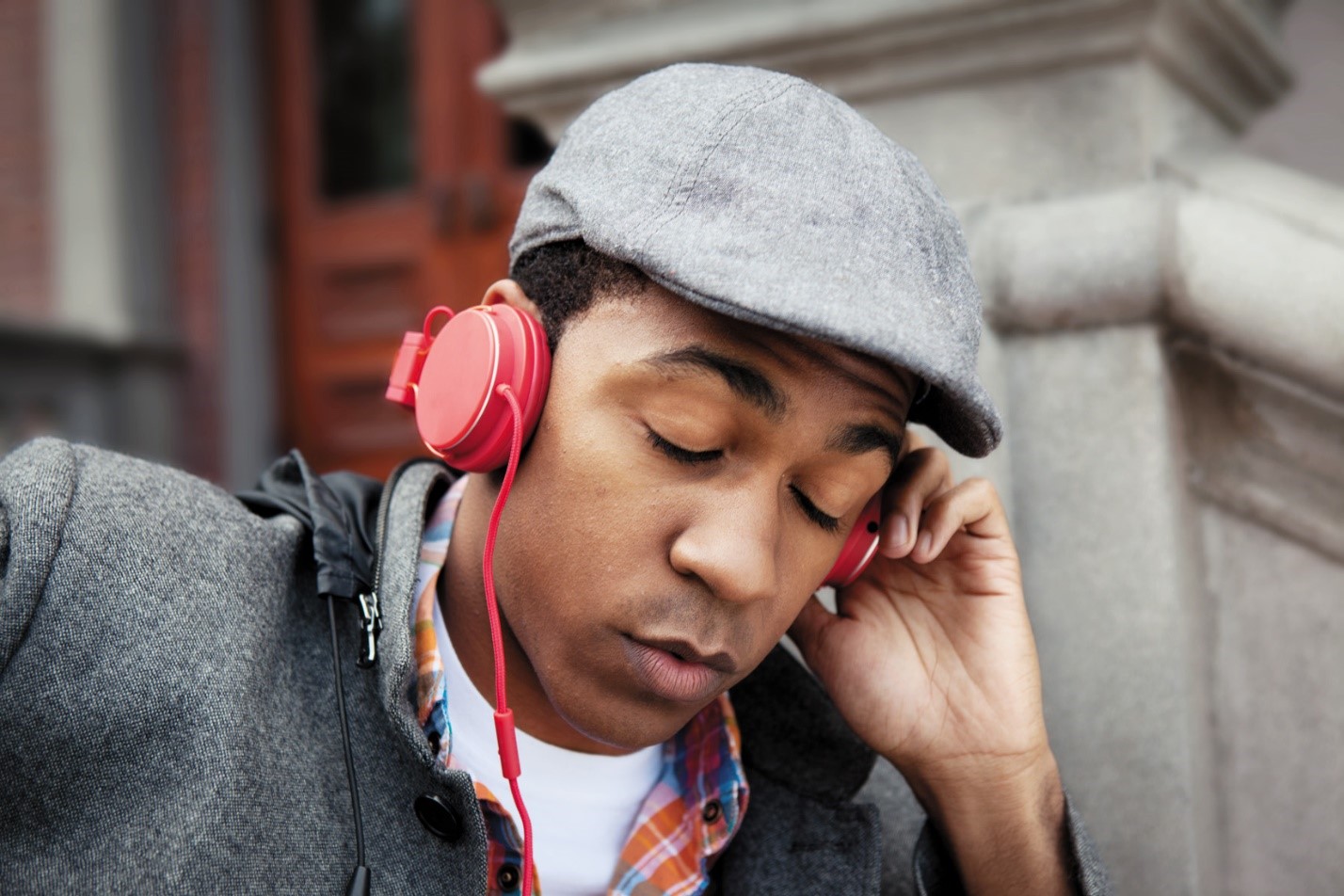 a person wearing a hat talking on a cell phone