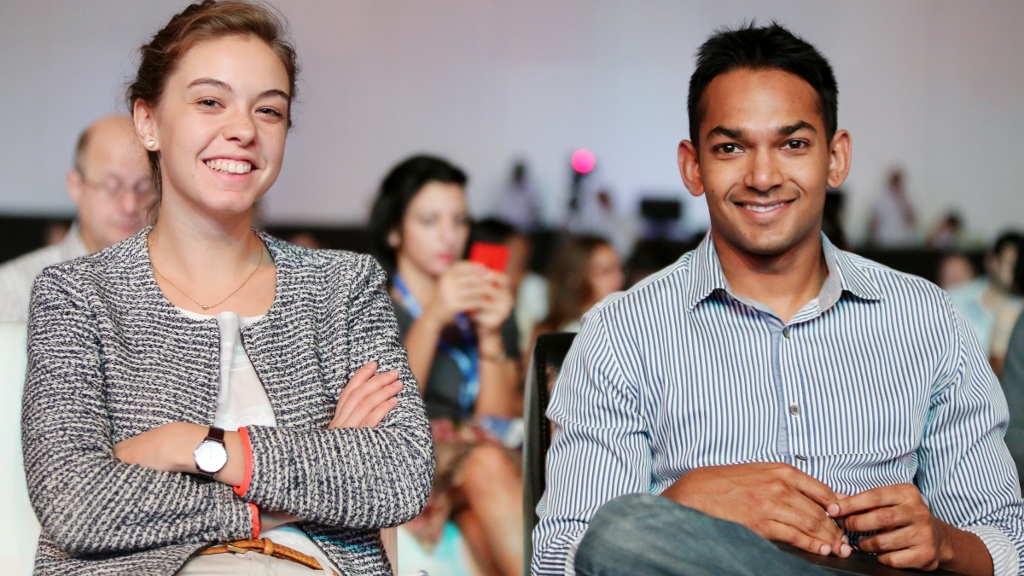 a man and a woman smiling for the camera