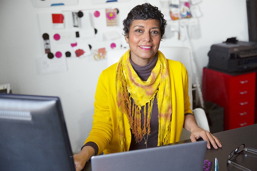 a man sitting in front of a laptop computer