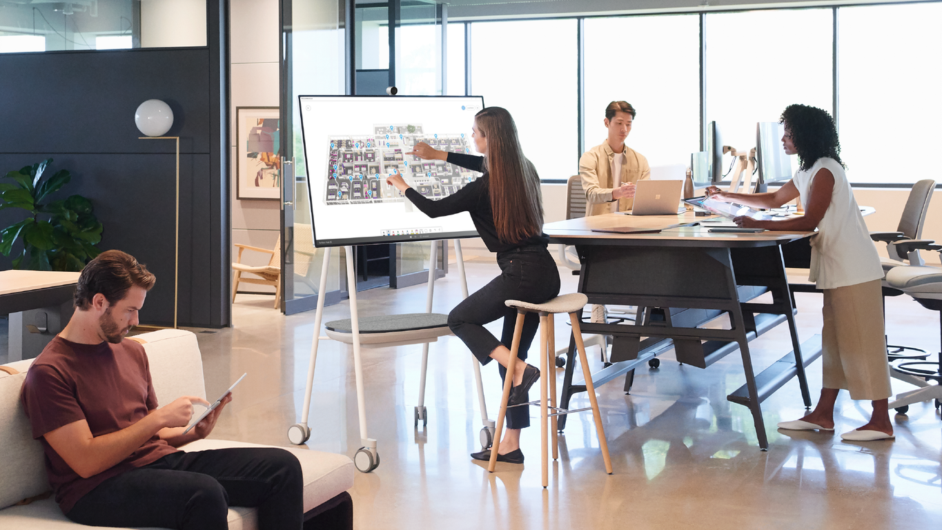 a room with people sitting at a table