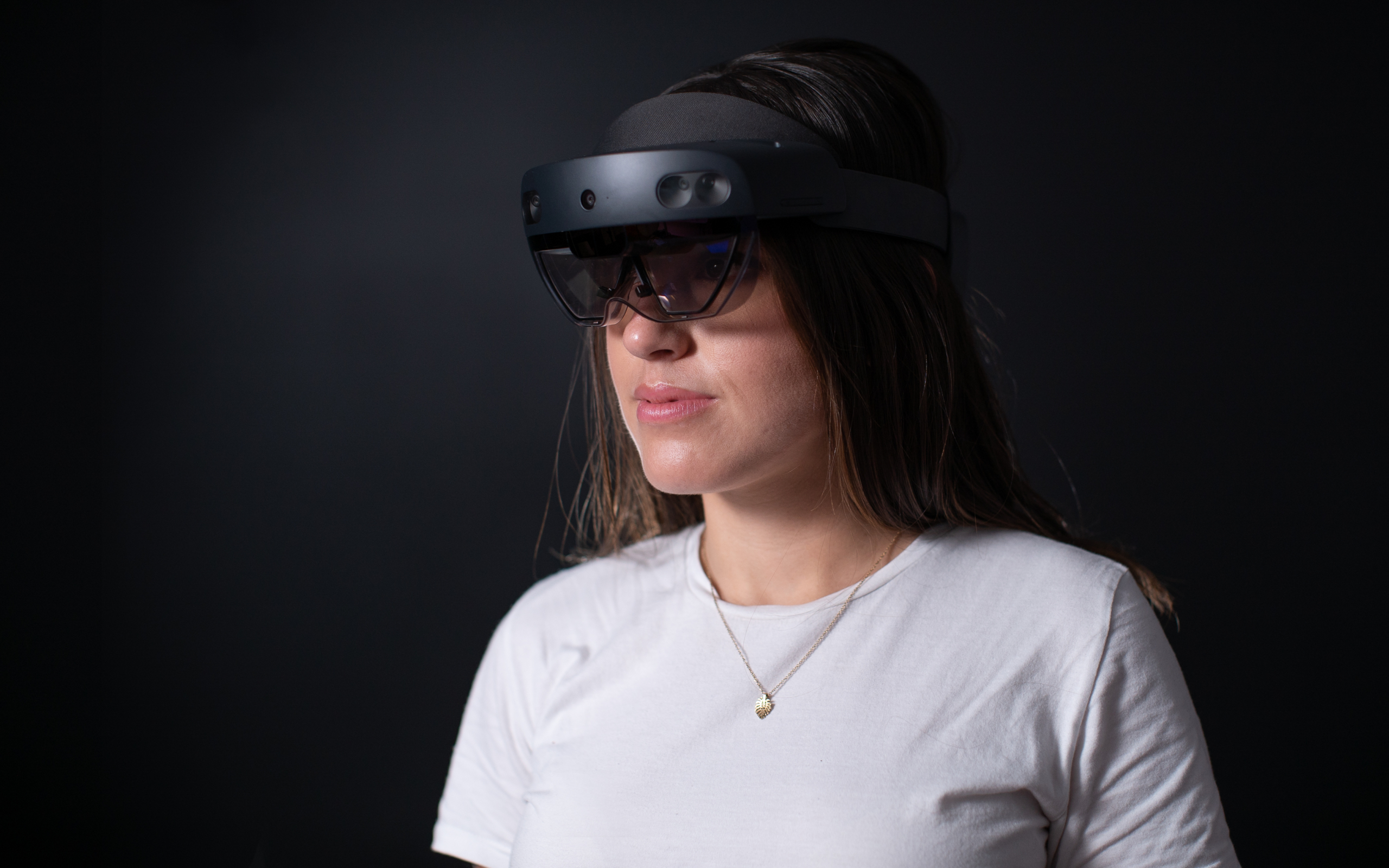 A picture of Melissa wearing a Microsoft HoloLens