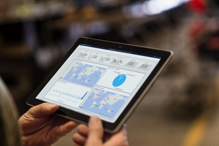 Close-up of two hands holding a tablet
