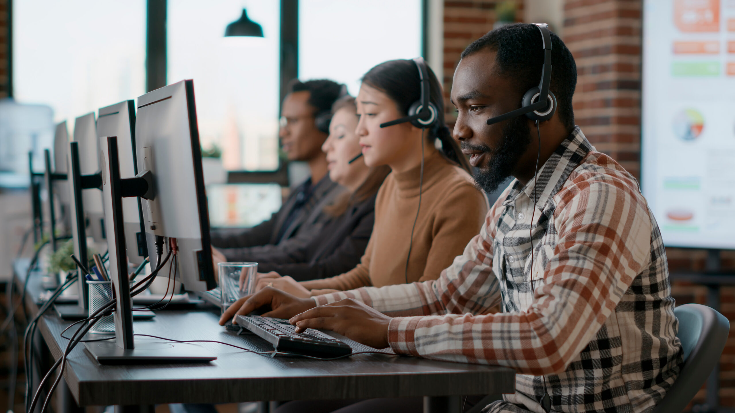 A group of people working at computers