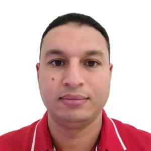Person wearing a red collared shirt with white piping detail, shown against a plain white background