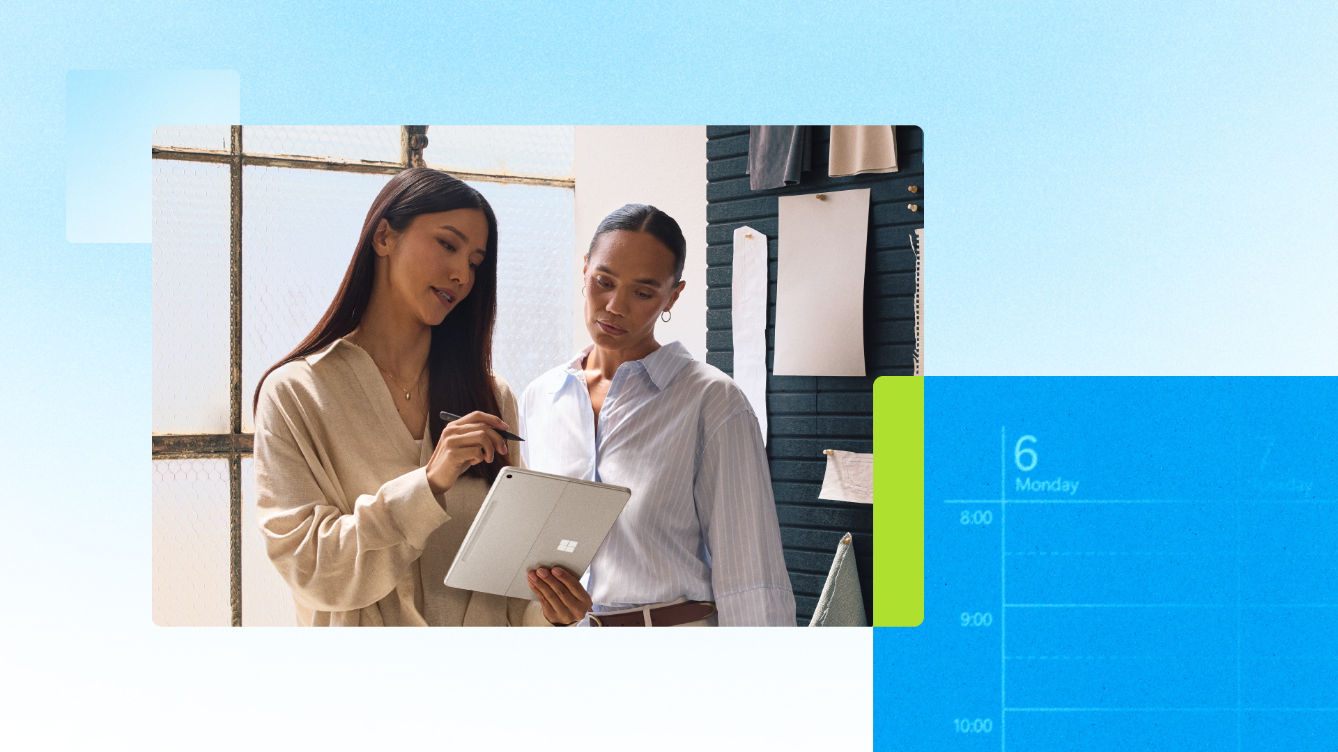 Two people reviewing content on a Microsoft Surface tablet