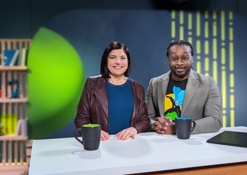 Paige Johnson and Corey Lee sitting at a desk together. 