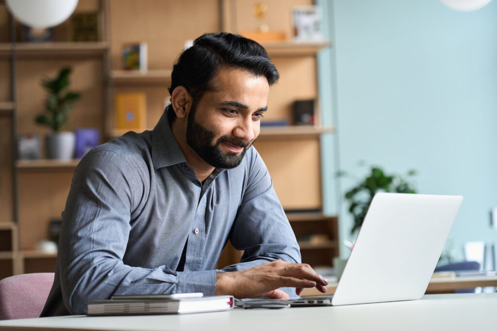 A person working on a laptop from home. 