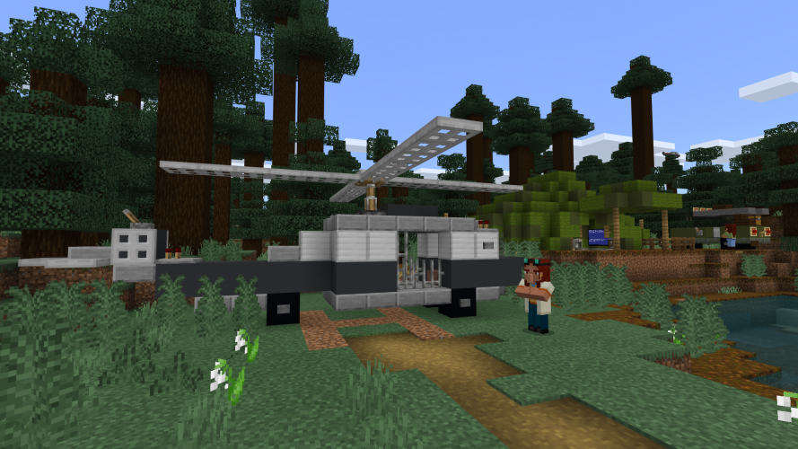 A person stands next to a helicopter in Minecraft: Education Edition