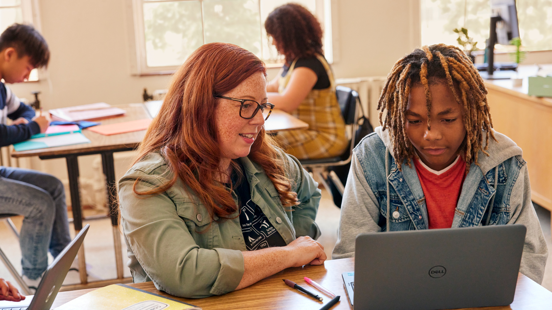 Teacher engaging with one of her students
