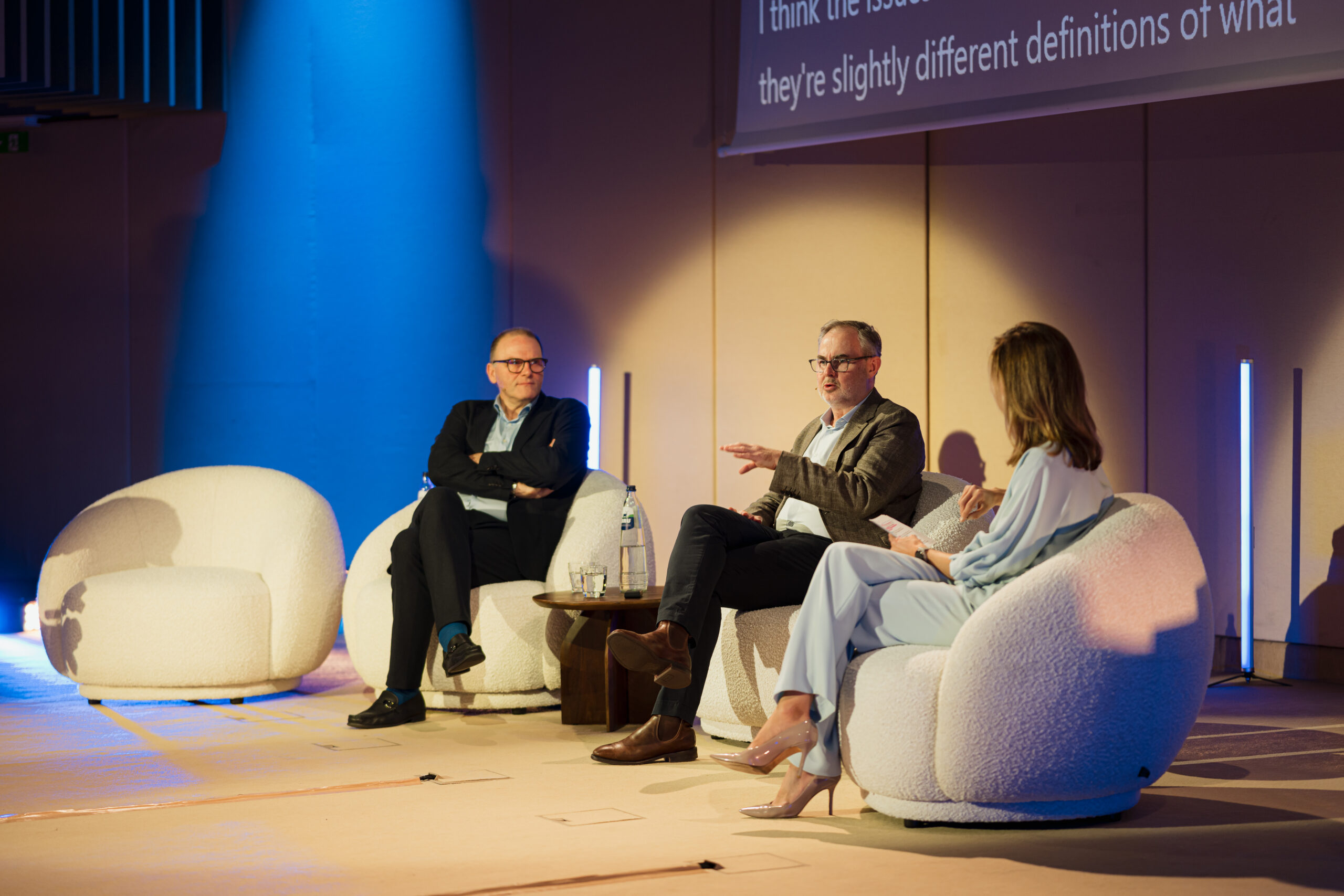 Three leaders speak on stage at the 2026 Microsoft Digital Sovereignty Summit.