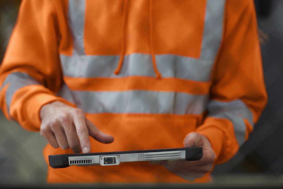 Picture of a person holding a tablet