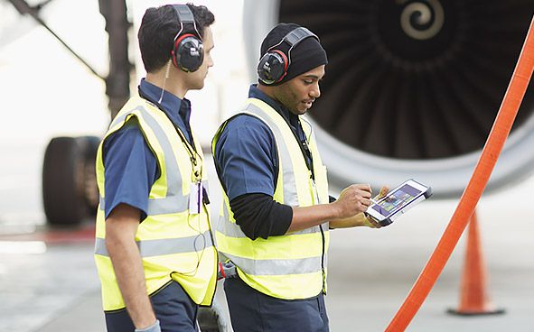 Panasonic Toughpad being used by a couple of ground crew workers