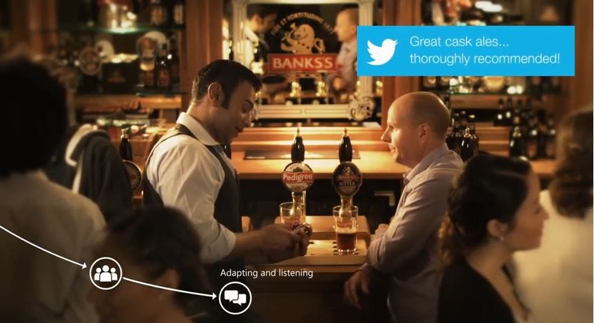 Two man discussing businesses at a bar